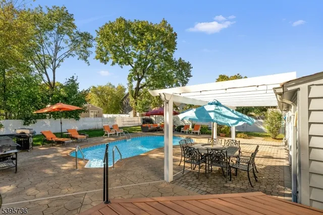 a view of a livingroom with wooden floor and white doors