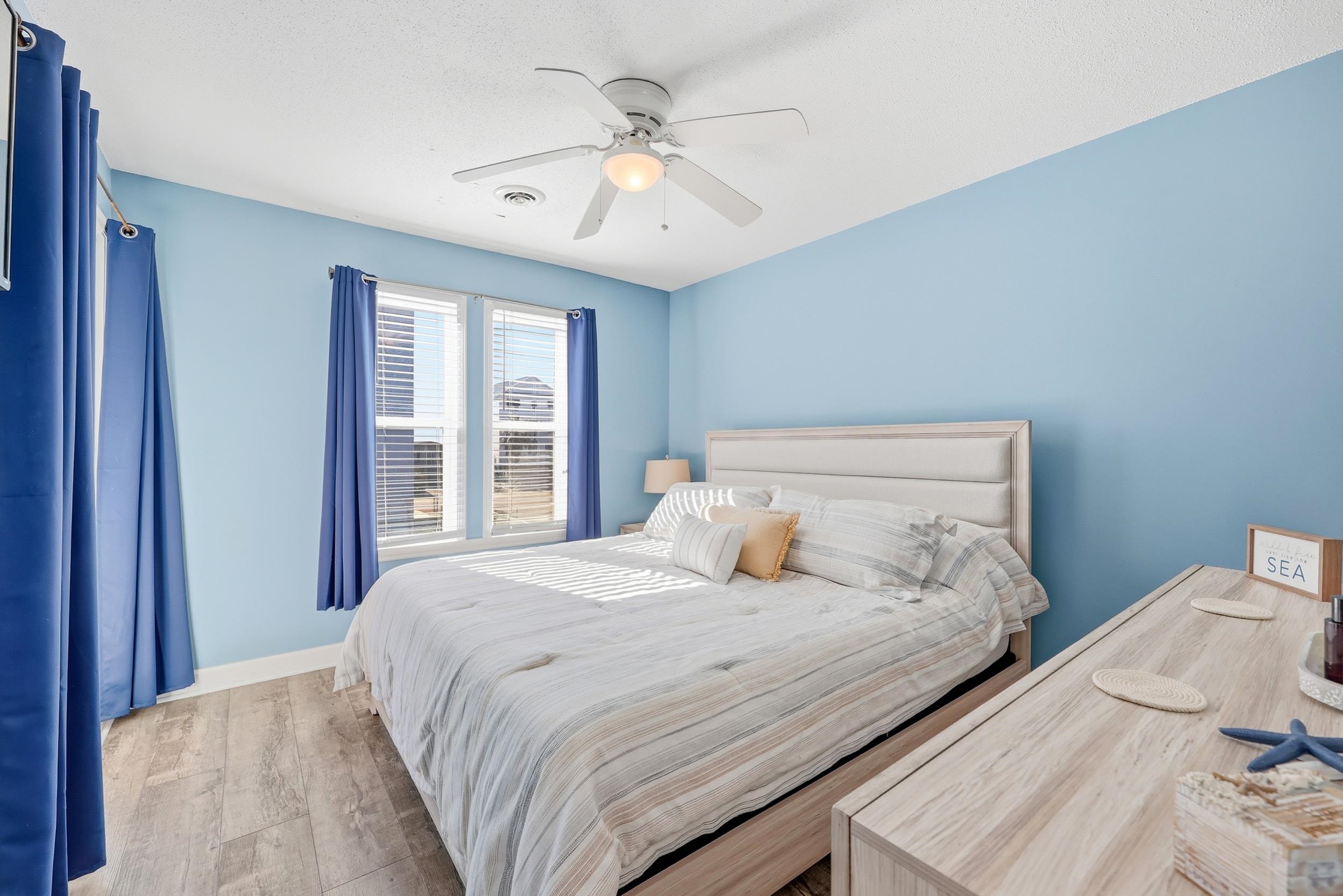 2001 Spring Street, Unit H2 North Myrtle Beach, SC 29582 - Photo 12 of 25 Bedroom with wood finished floors and a ceiling fan