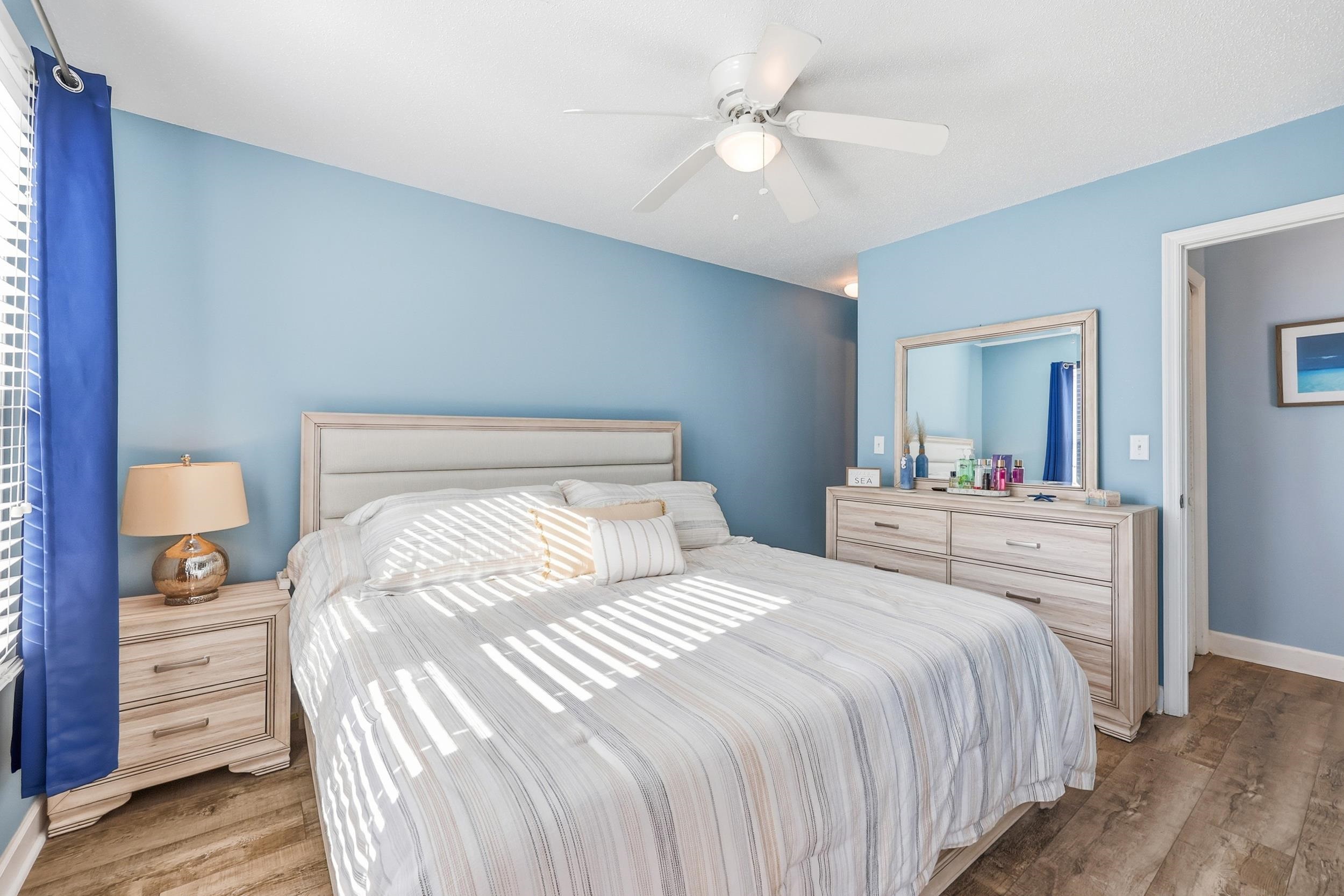 2001 Spring Street, Unit H2 North Myrtle Beach, SC 29582 - Photo 13 of 25 Bedroom with wood finished floors and ceiling fan
