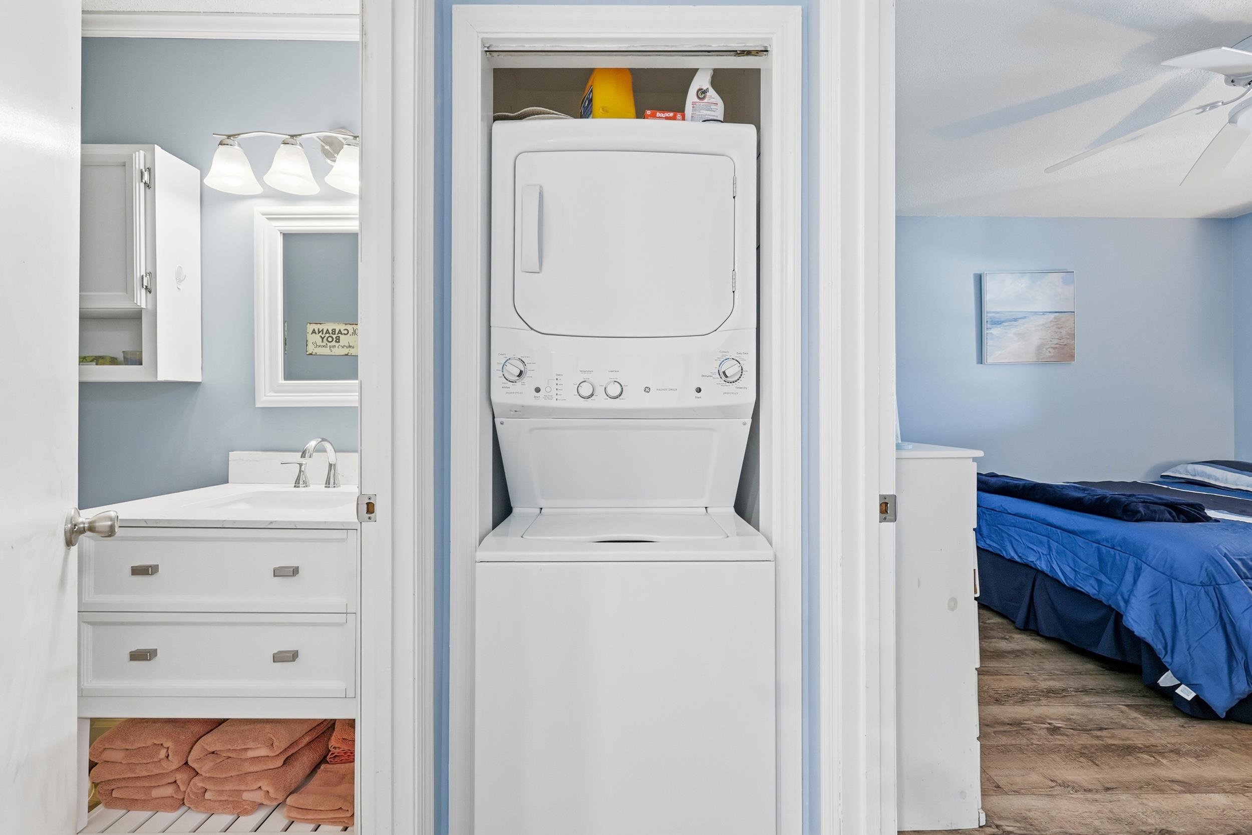 2001 Spring Street, Unit H2 North Myrtle Beach, SC 29582 - Photo 15 of 25 Washroom with stacked washing machine and dryer, wood finished floors, and ceiling fan
