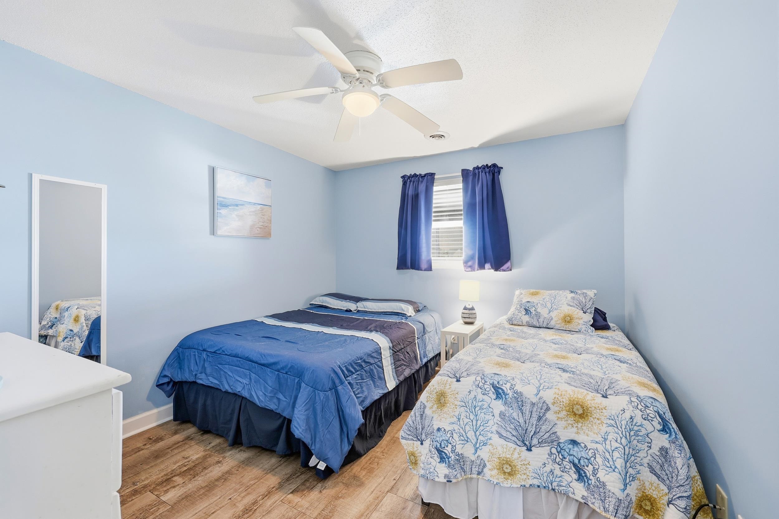 2001 Spring Street, Unit H2 North Myrtle Beach, SC 29582 - Photo 17 of 25 Bedroom featuring light wood-style flooring and a ceiling fan