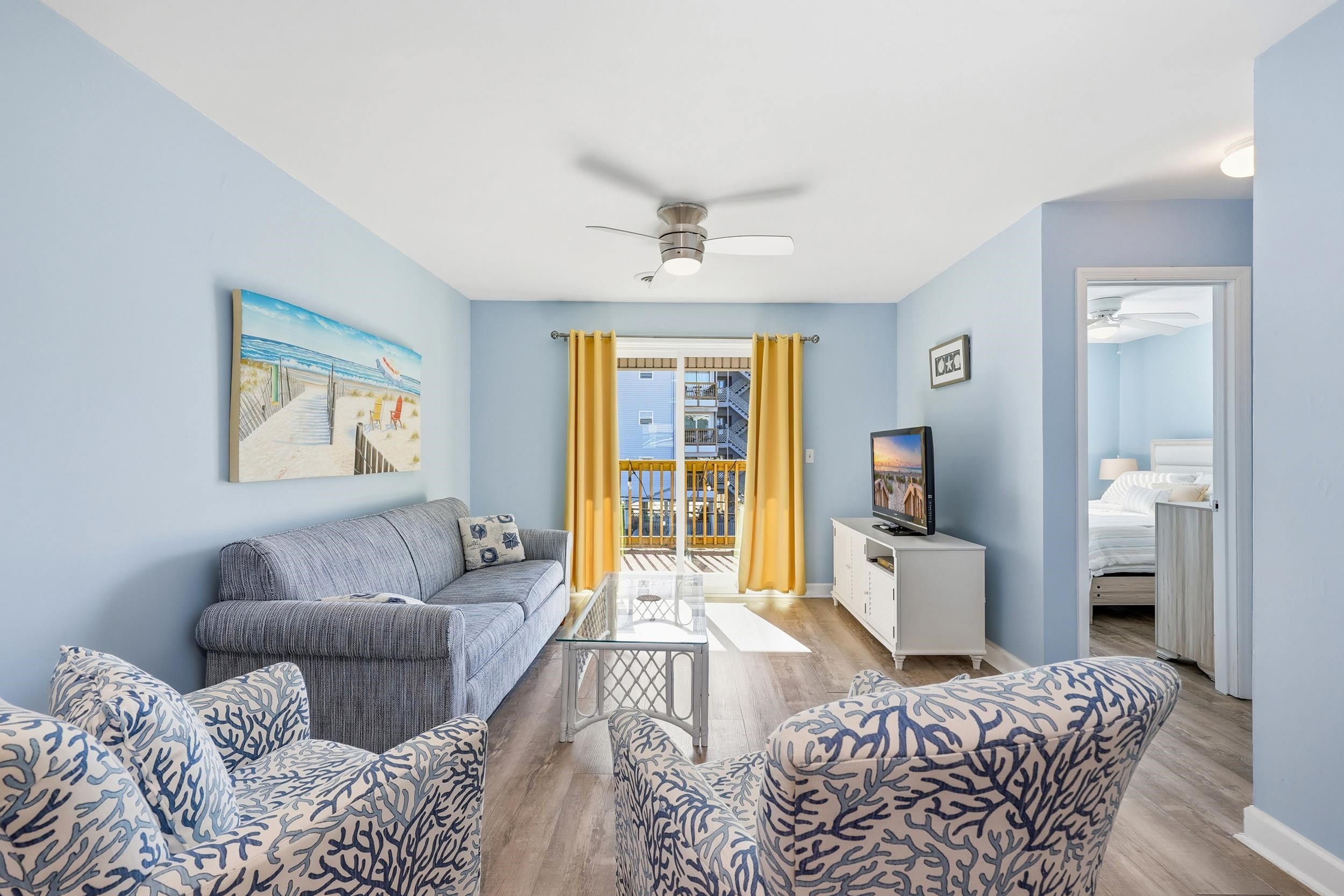 2001 Spring Street, Unit H2 North Myrtle Beach, SC 29582 - Photo 8 of 25 Living area with wood finished floors and a ceiling fan