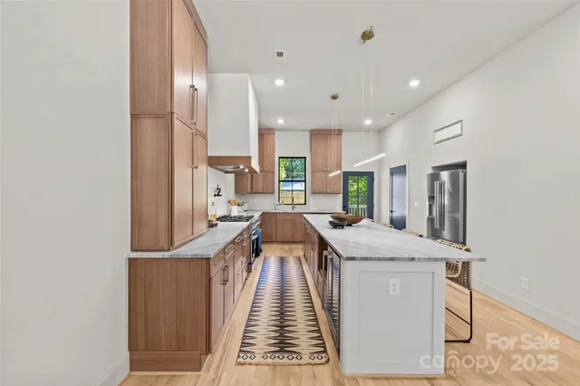 a very nice looking kitchen with a large window