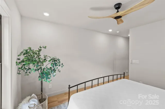 a bedroom with furniture and a window