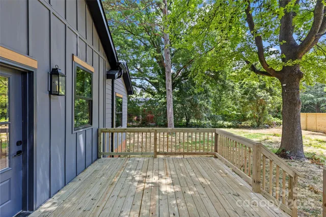 a view of a wooden bench in the back yard