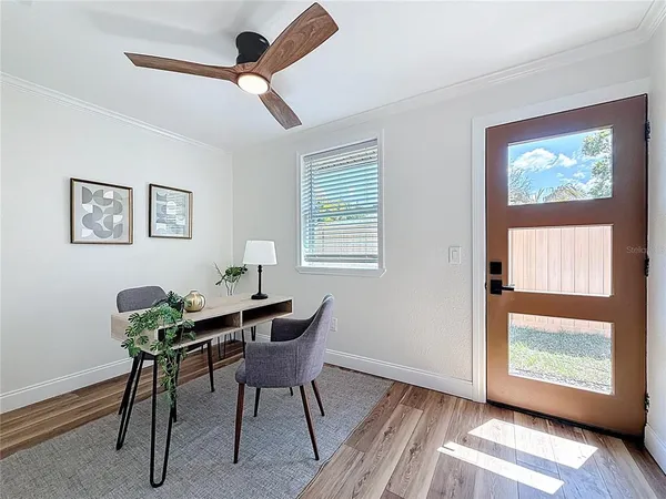 a spacious bathroom with a double vanity sink a mirror and a toilet