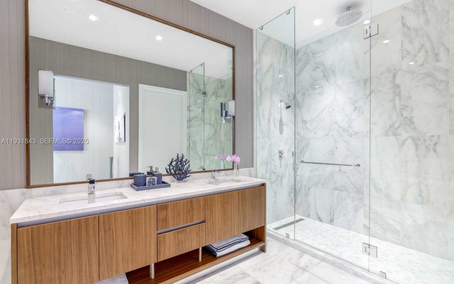 175 Southeast 25th Road, Unit 4201 Miami, FL 33129 - Photo 8 of 25 a bathroom with a double vanity sink mirror and shower