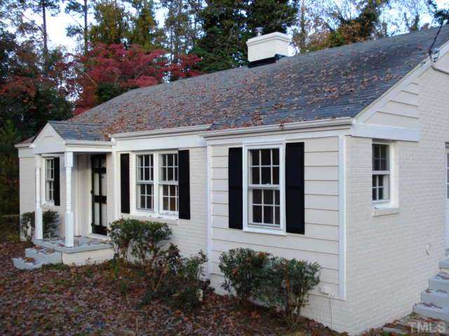 3038 Lewis Farm Road Raleigh, NC 27607 - Photo 2 of 12 a front view of a house with garden