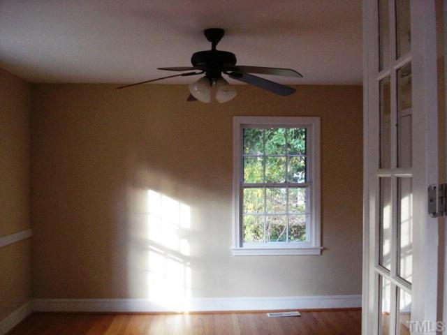 3038 Lewis Farm Road Raleigh, NC 27607 - Photo 7 of 12 a view of a room that has a window in it