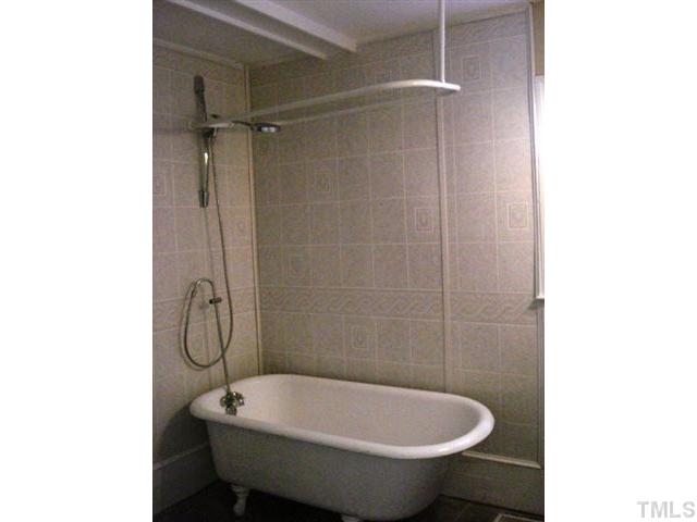 3038 Lewis Farm Road Raleigh, NC 27607 - Photo 10 of 12 a bathroom with a sink and a shower