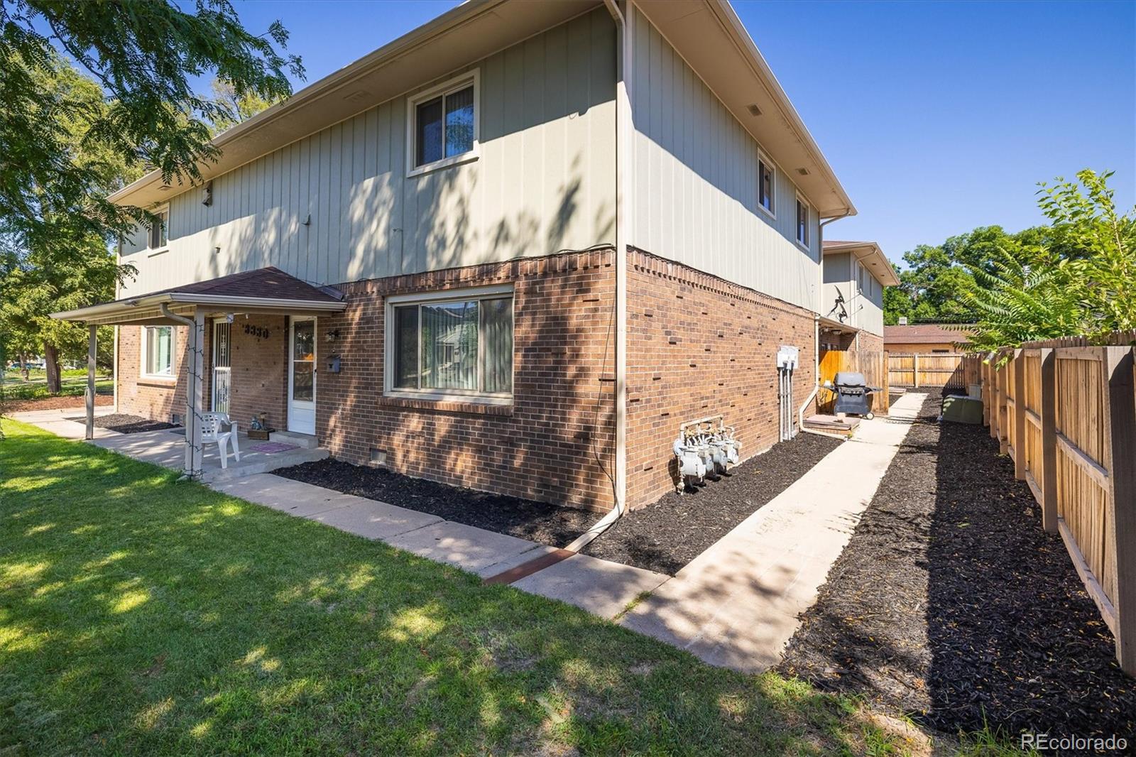 3830 Otis Street, Unit 14 Wheat Ridge, CO 80033 - Photo 20 of 26 a view of a house with backyard