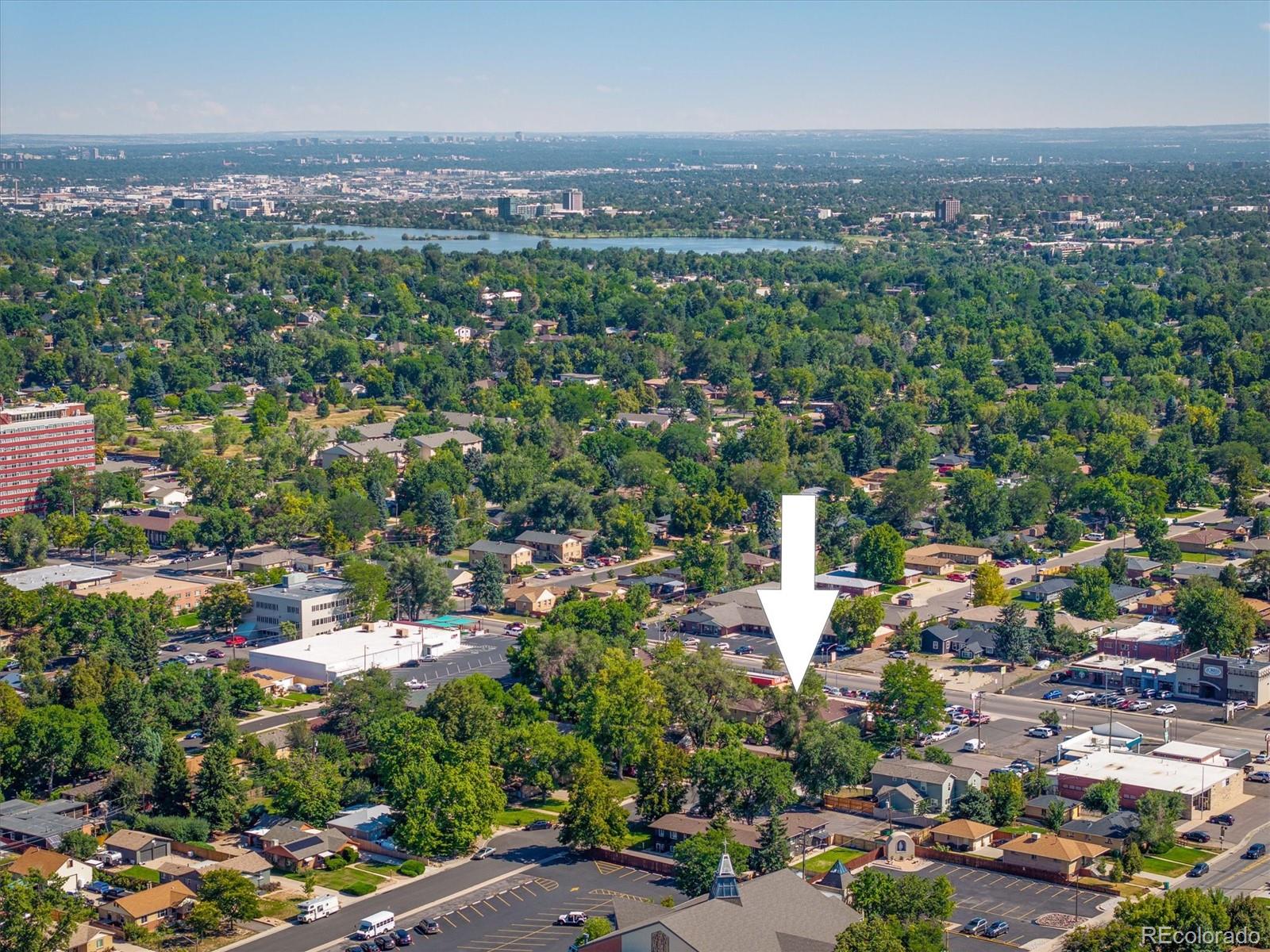 3830 Otis Street, Unit 14 Wheat Ridge, CO 80033 - Photo 23 of 26 an aerial view of a city with lots of residential buildings