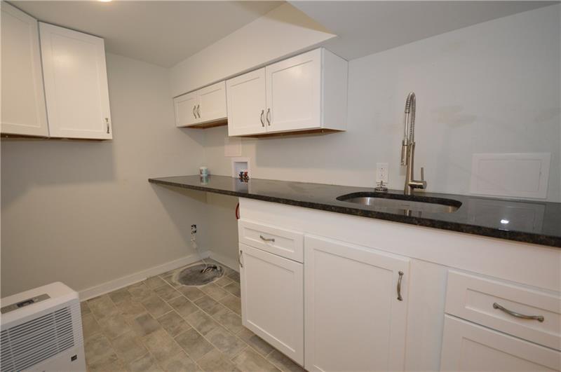 807 Valleyview Road Pittsburgh, PA 15243 - Photo 18 of 25 Lower level laundry room with custom built-ins and additional attached bathroom.