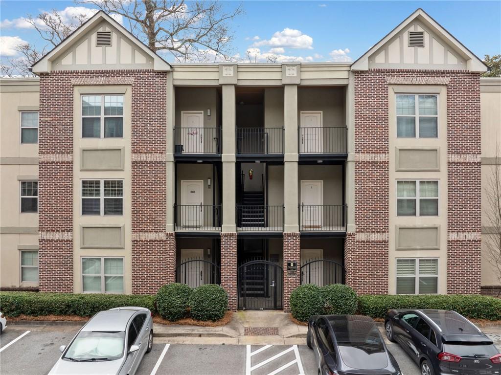 1903 Anjaco Road Northwest, Unit 3 Atlanta, GA 30309 - Photo 1 of 1 a front view of a building with windows