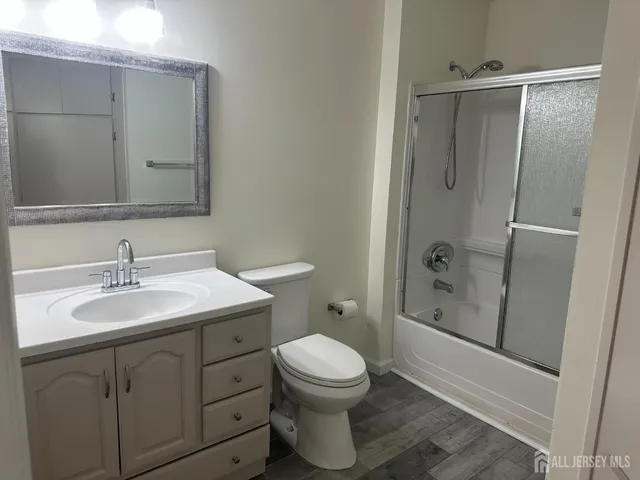 a bathroom with a toilet sink a shower and