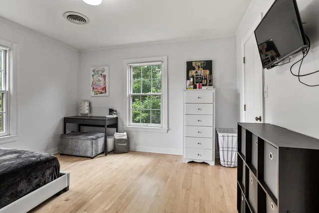 a room with a bed and a window