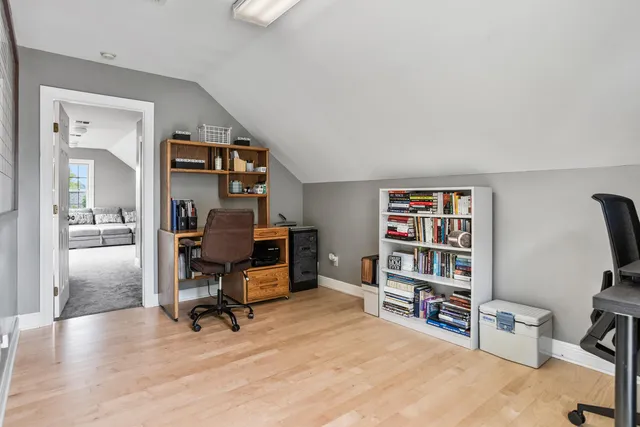 a view of a workspace with furniture and cabinet