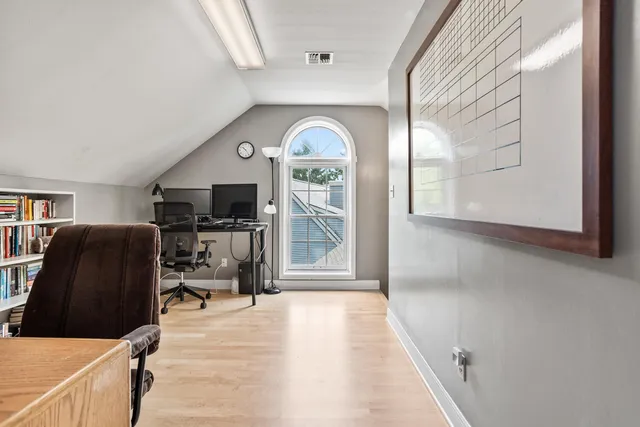 a view of a livingroom with furniture and a flat screen tv