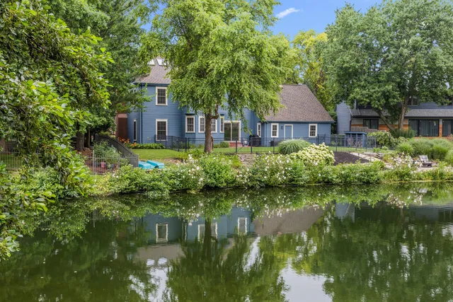 a view of a backyard with plants and a patio