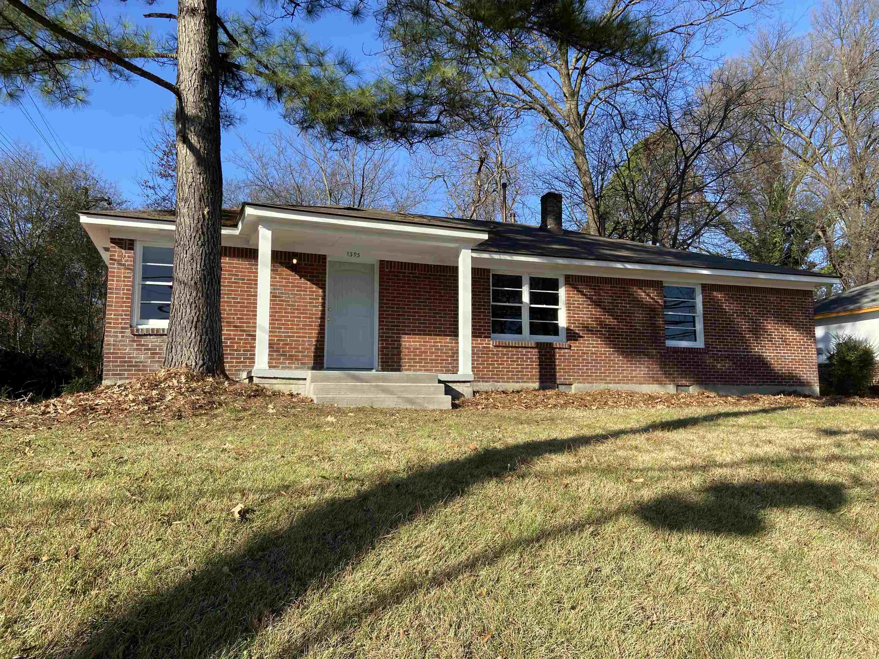 1395 Prescott Road Memphis, TN 38111 - Photo 1 of 18 a view of a house with a yard and garage