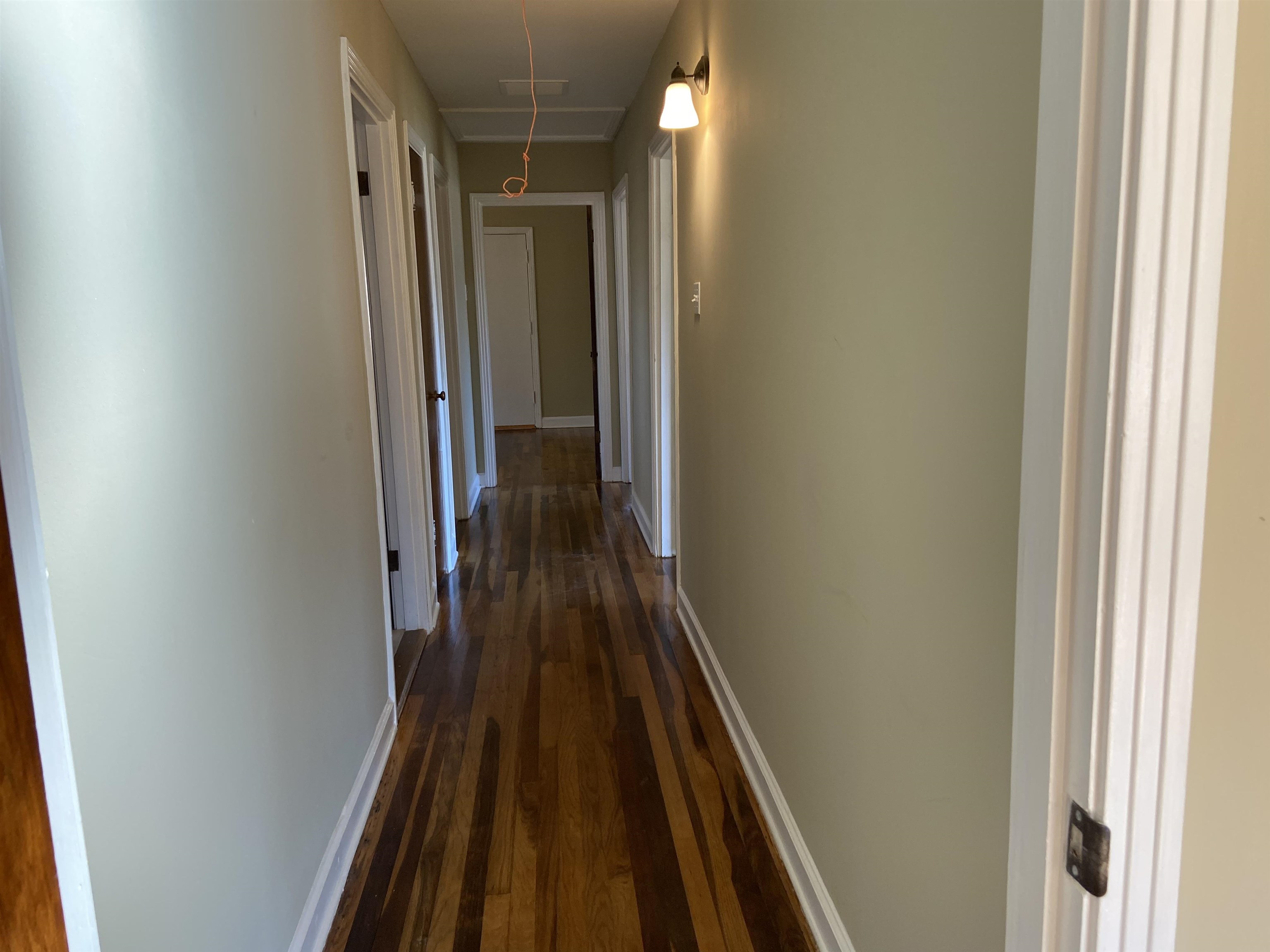 1395 Prescott Road Memphis, TN 38111 - Photo 11 of 18 a view of a hallway with wooden floor and staircase