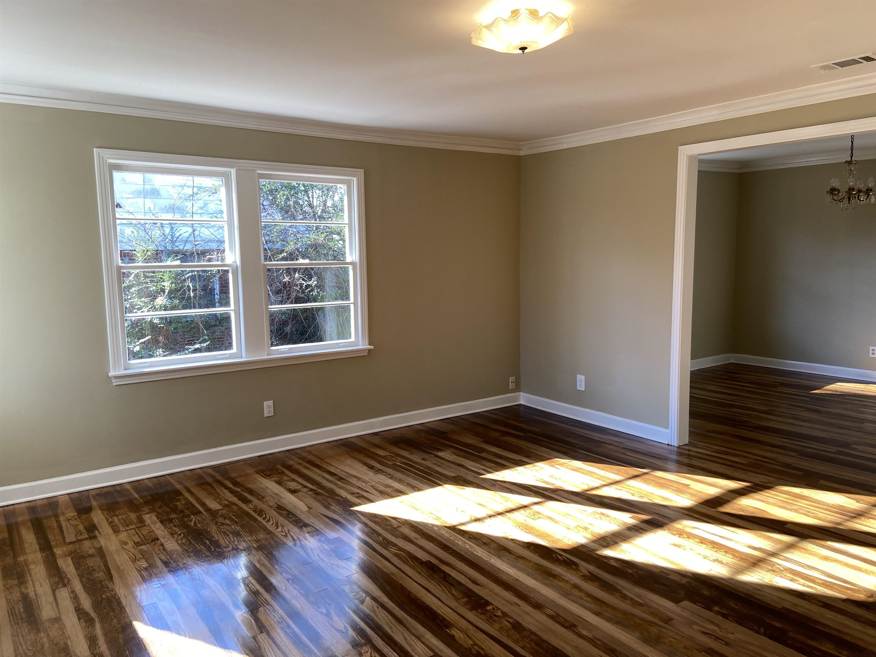 1395 Prescott Road Memphis, TN 38111 - Photo 4 of 18 a view of an empty room and window