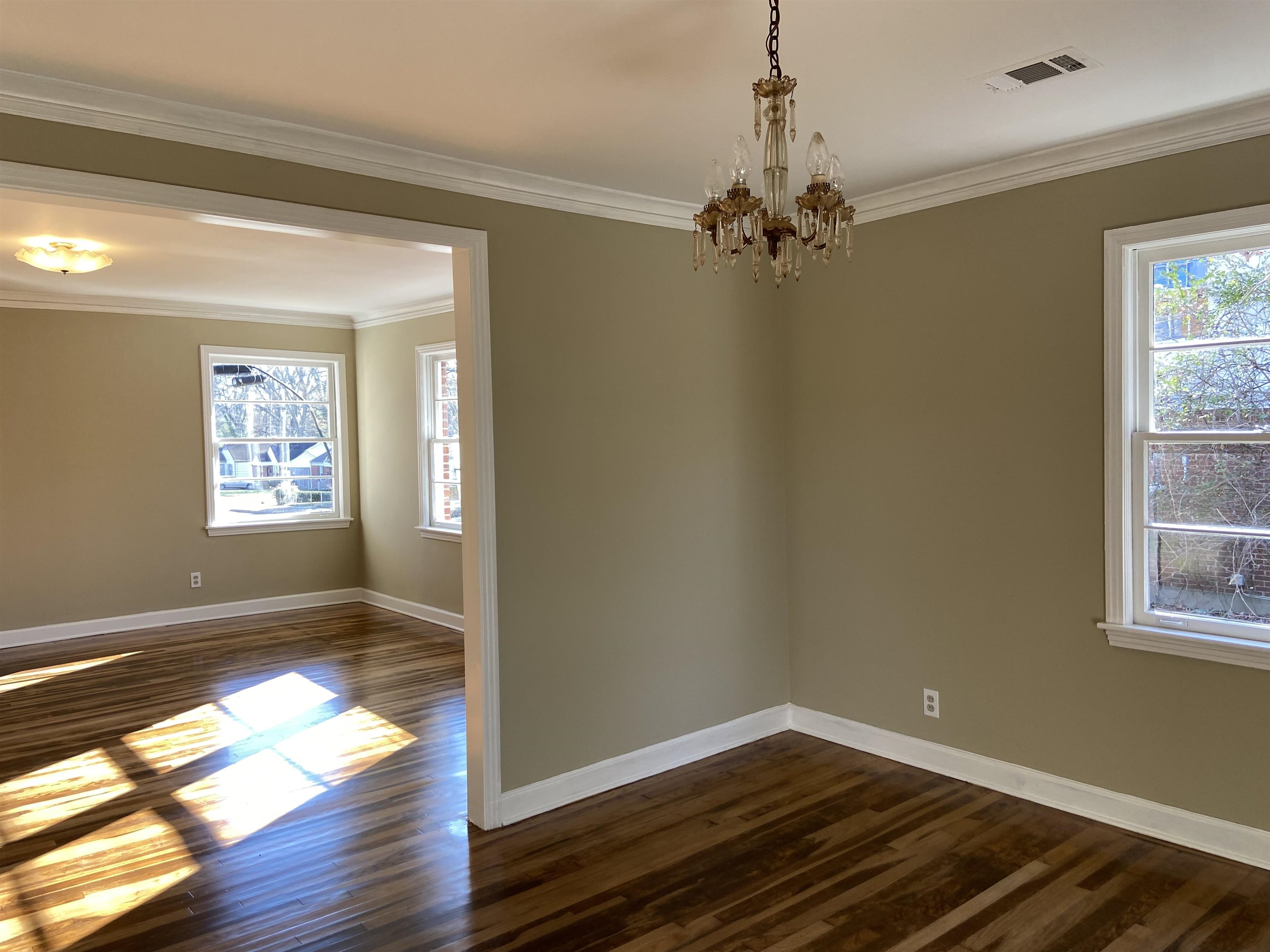 1395 Prescott Road Memphis, TN 38111 - Photo 5 of 18 a view of empty room with wooden floor and fan