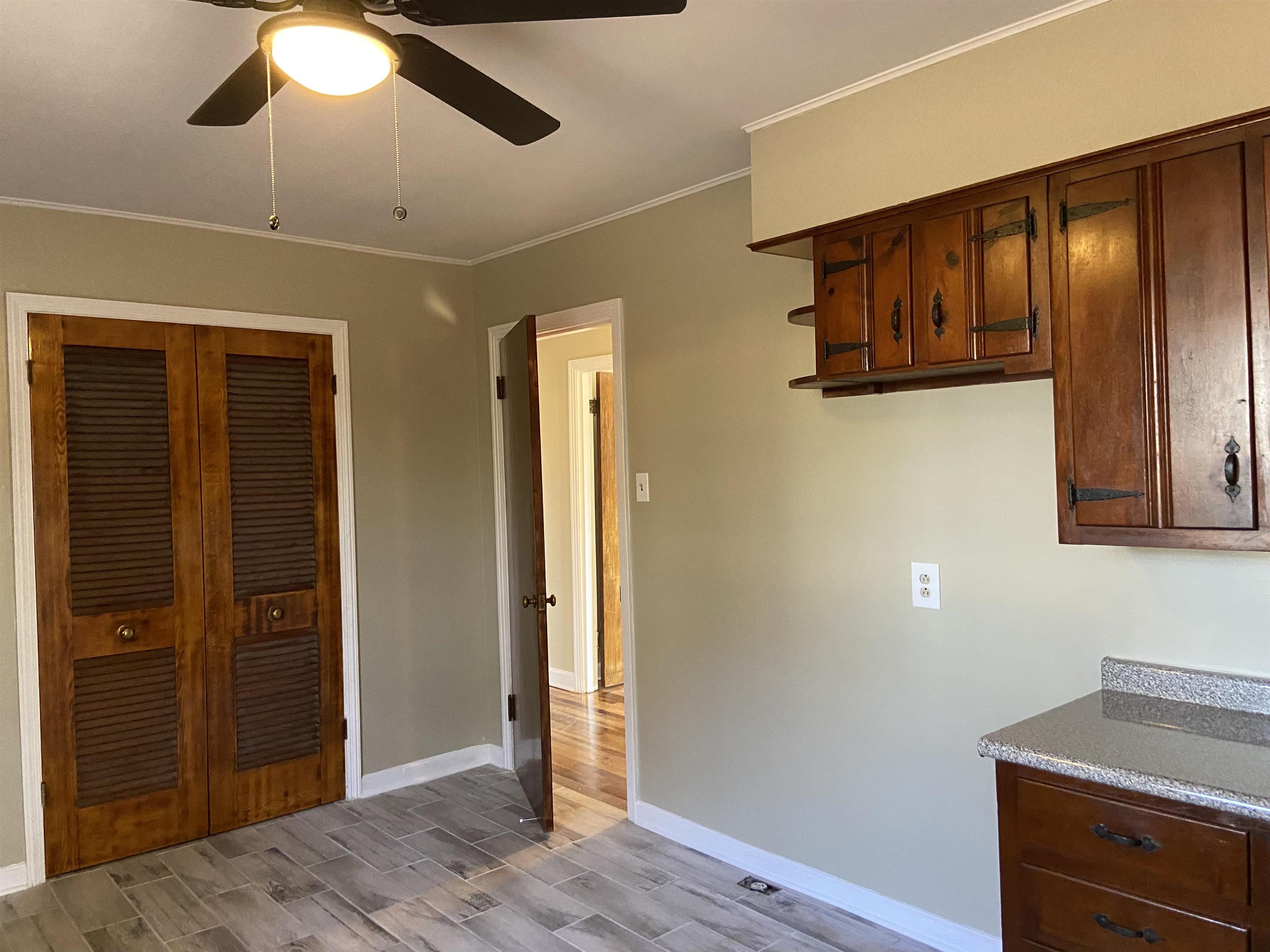 1395 Prescott Road Memphis, TN 38111 - Photo 10 of 18 a view of a hallway with wooden floor and staircase