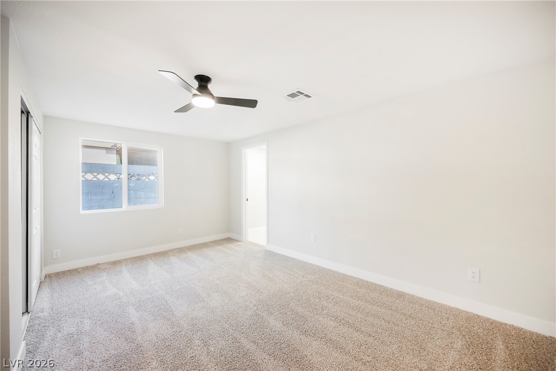 223 West Basic Road Henderson, NV 89015 - Photo 16 of 19 Soft carpeting pairs with crisp walls under a smooth, clean ceiling.