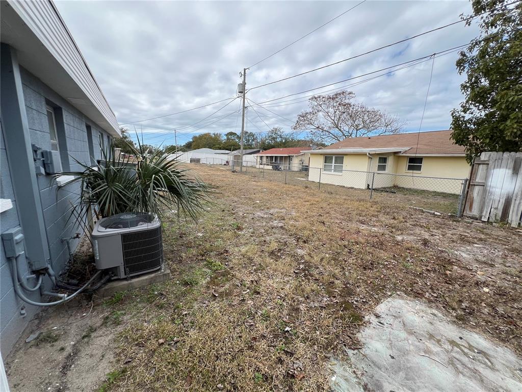 5333 Pasadena Drive, Unit 5333 New Port Richey, FL 34652 - Photo 11 of 12 a view of a house with yard and tree s