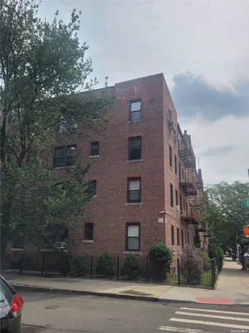 a tall building sitting on the side of a street