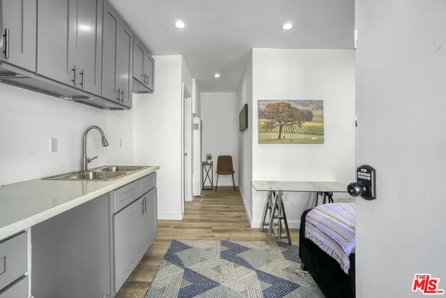 a kitchen with a sink and cabinets
