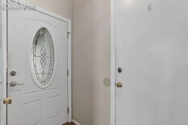 a bathroom with a large mirror and a shower