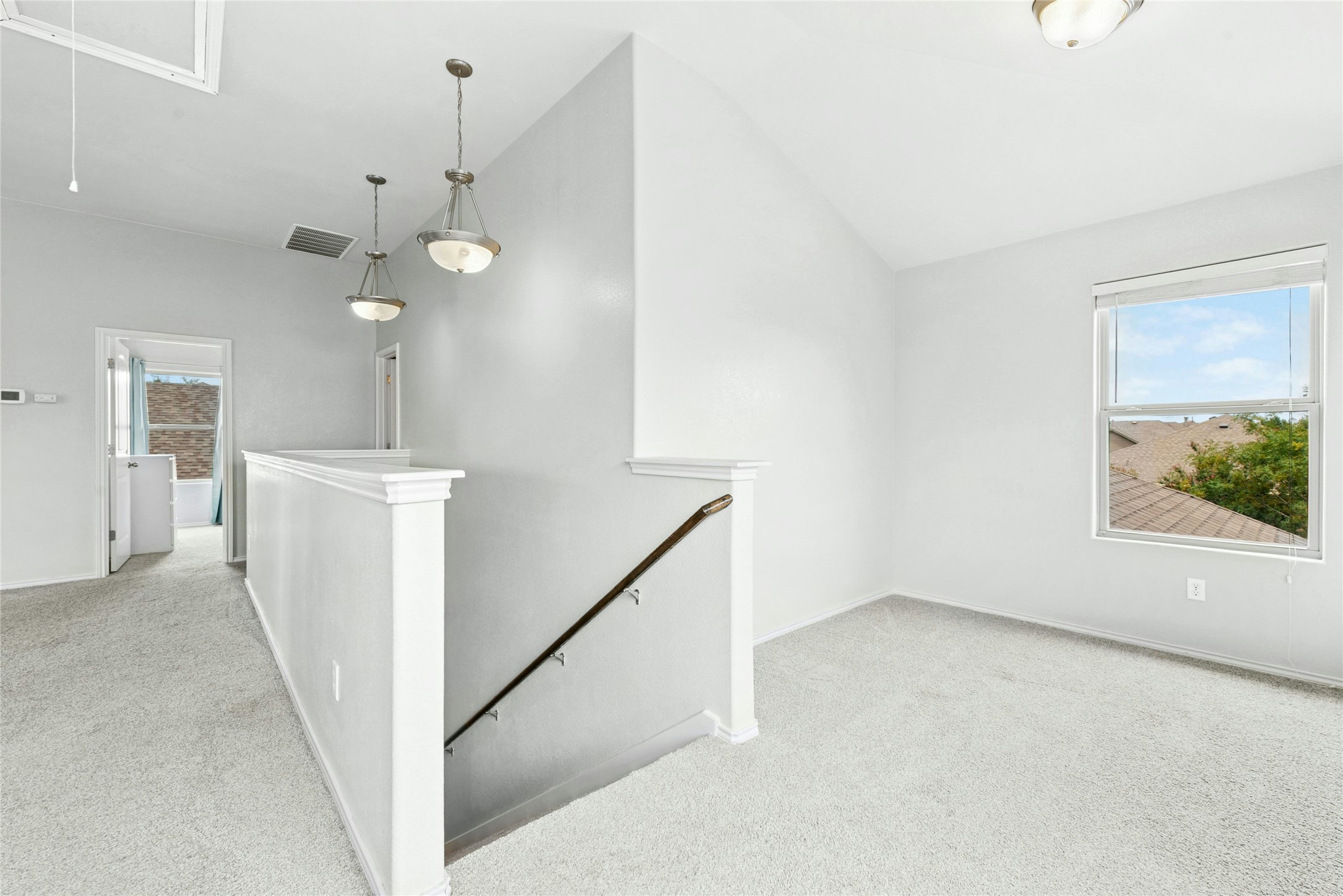 390 Fletcher Bend Buda, TX 78610 - Photo 17 of 36 wooden floor in an empty room with a window