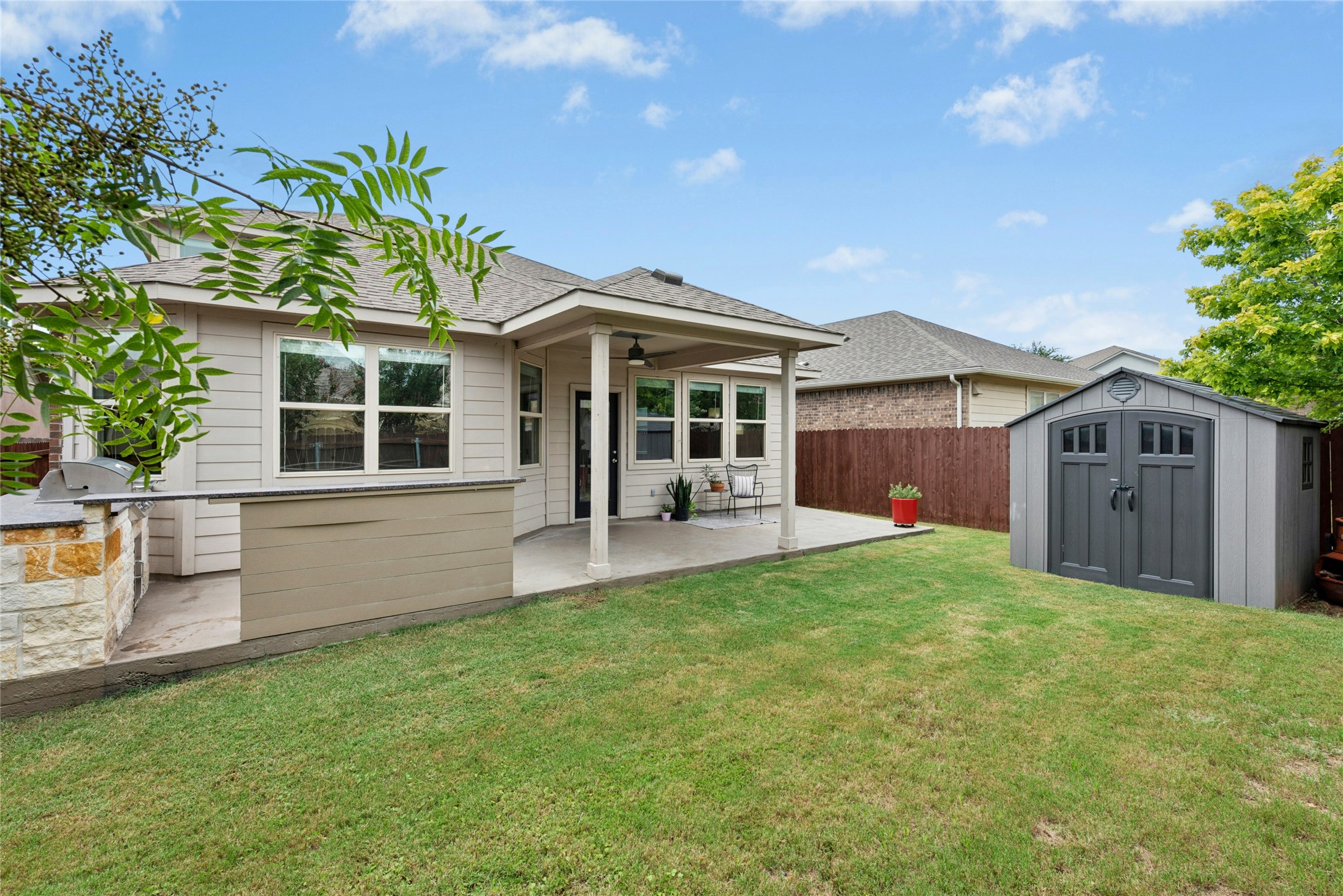390 Fletcher Bend Buda, TX 78610 - Photo 27 of 36 a view of a house with a backyard