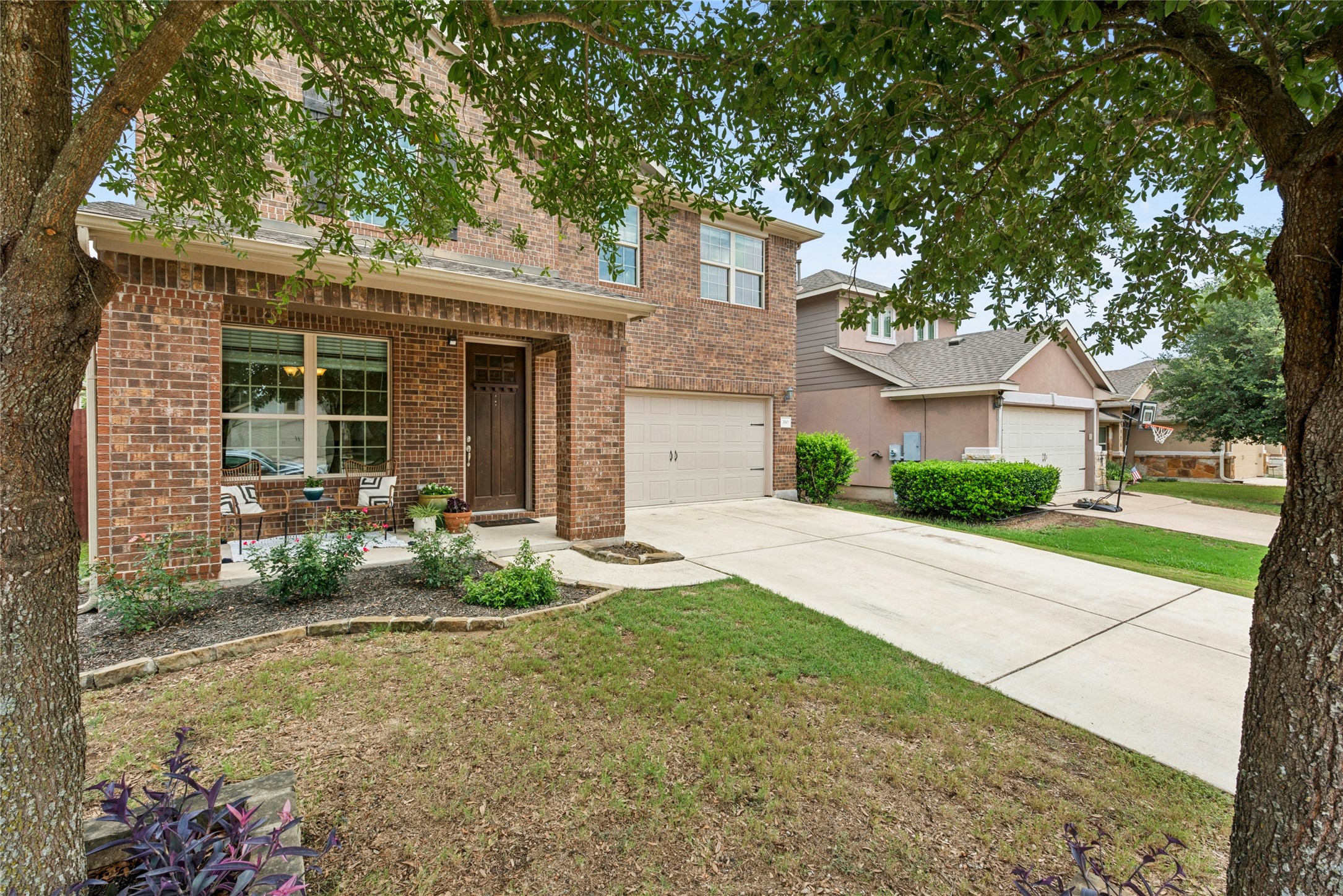 390 Fletcher Bend Buda, TX 78610 - Photo 33 of 36 a front view of a house with garden