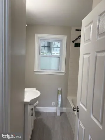 a view of a room that has a bench in it