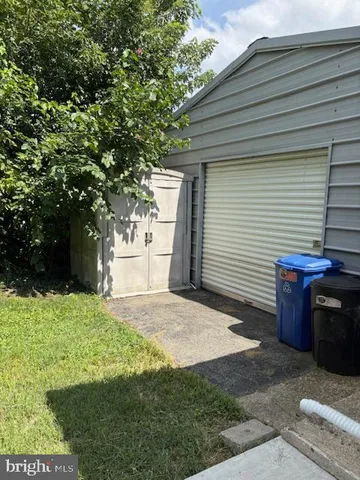 a backyard of a house with oven and garden