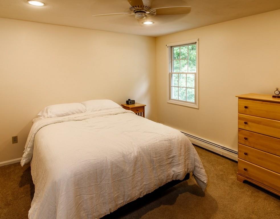 112 Upton Road Westborough, MA 01581 - Photo 25 of 41 a bed sitting in a bedroom next to a window
