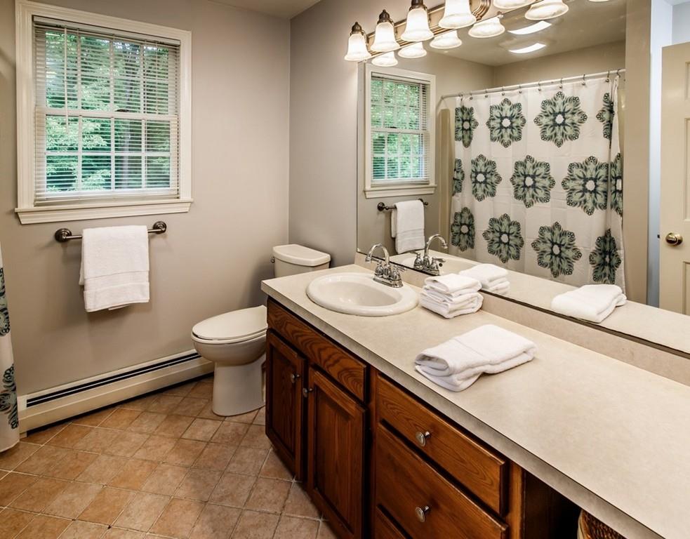 112 Upton Road Westborough, MA 01581 - Photo 30 of 41 a bathroom with a granite countertop sink and a mirror