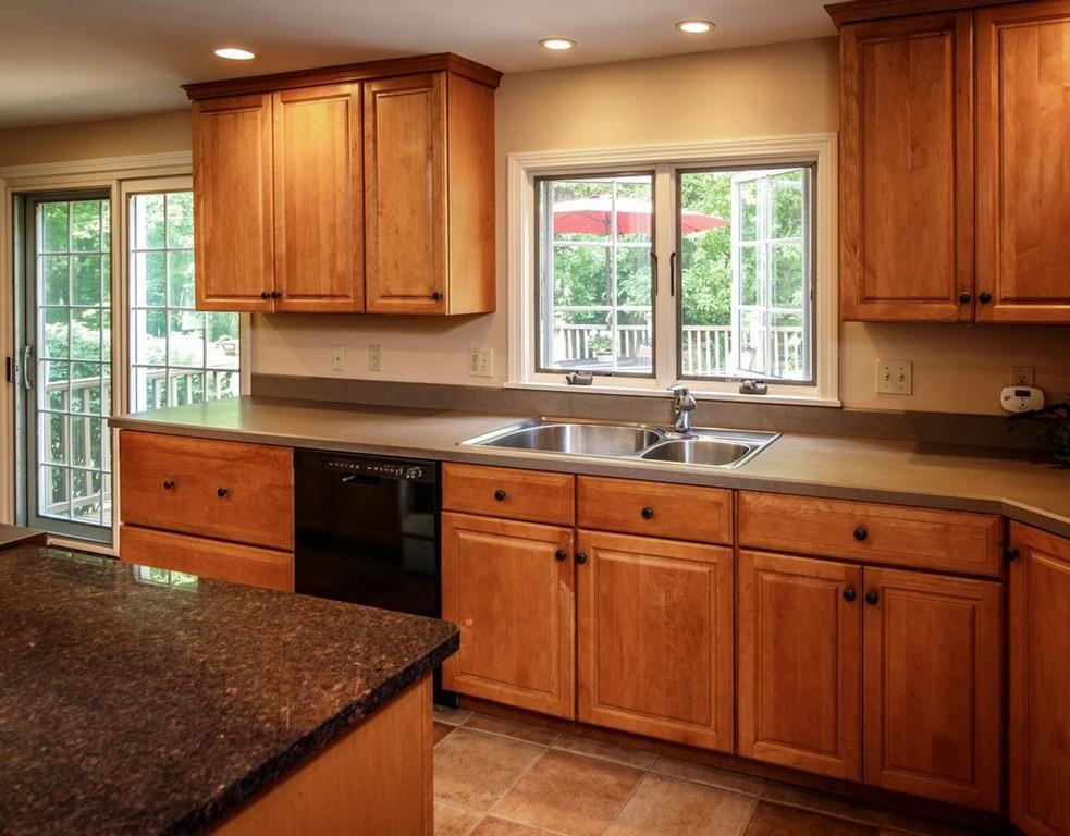 112 Upton Road Westborough, MA 01581 - Photo 3 of 41 a kitchen with granite countertop wooden cabinets stainless steel appliances a sink and a window