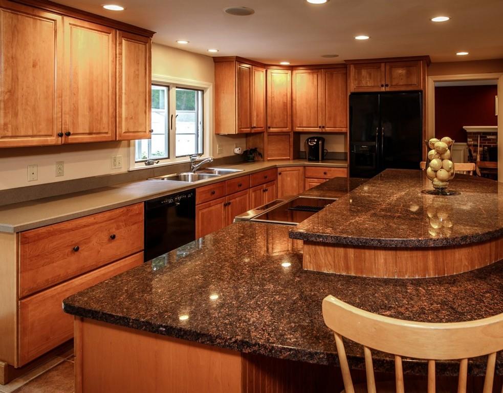 112 Upton Road Westborough, MA 01581 - Photo 5 of 41 a kitchen with stainless steel appliances granite countertop a sink a stove a counter space and a large window