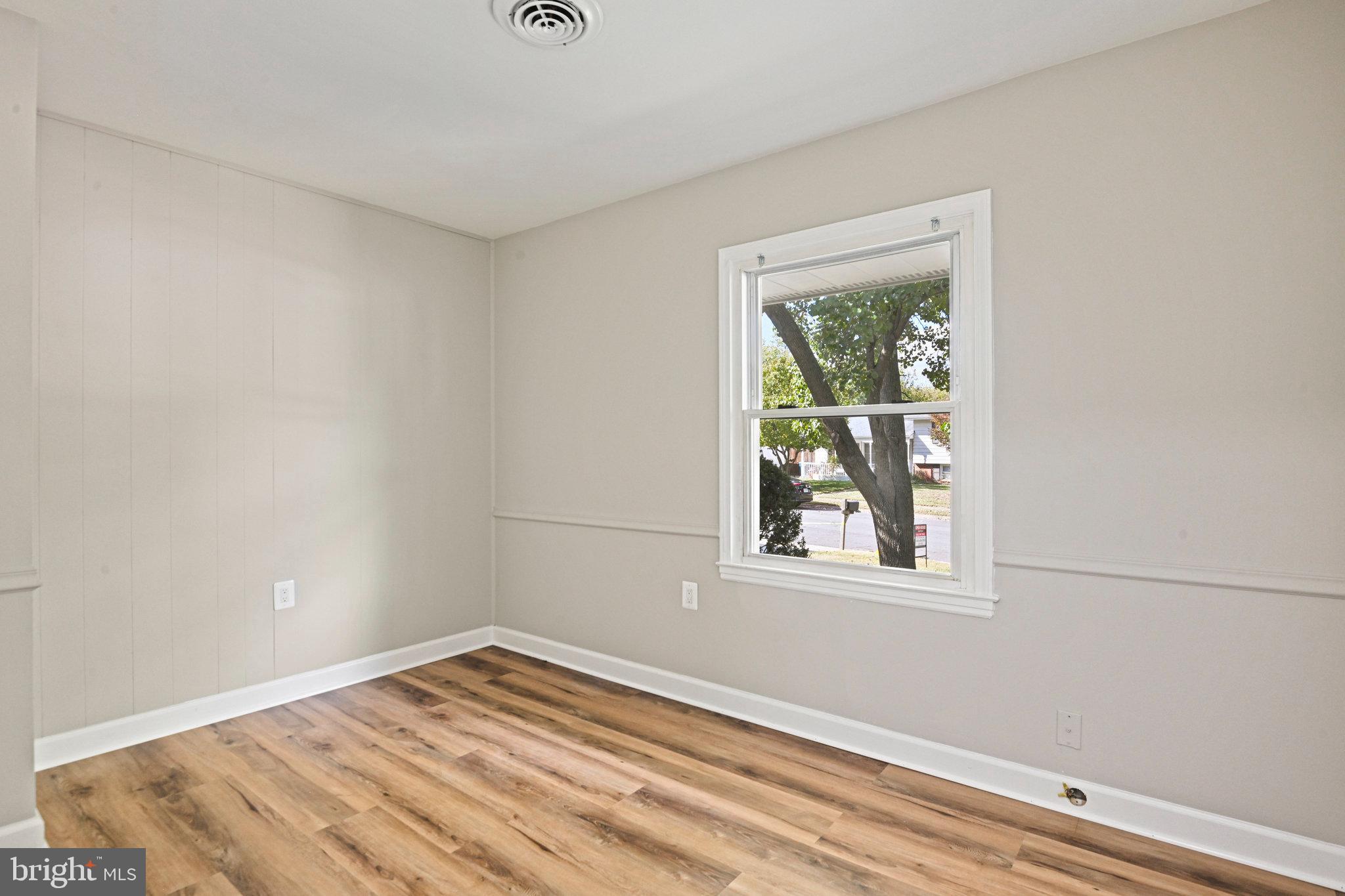 1002 South Buckingham Road Sterling, VA 20164 - Photo 13 of 18 a view of empty room with wooden floor and fan