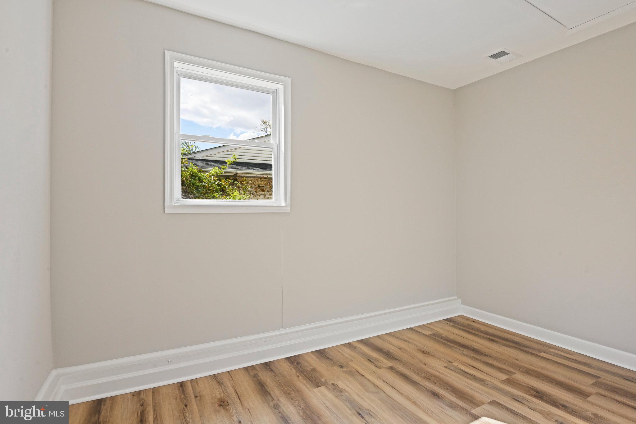 1002 South Buckingham Road Sterling, VA 20164 - Photo 14 of 18 an empty room with a window