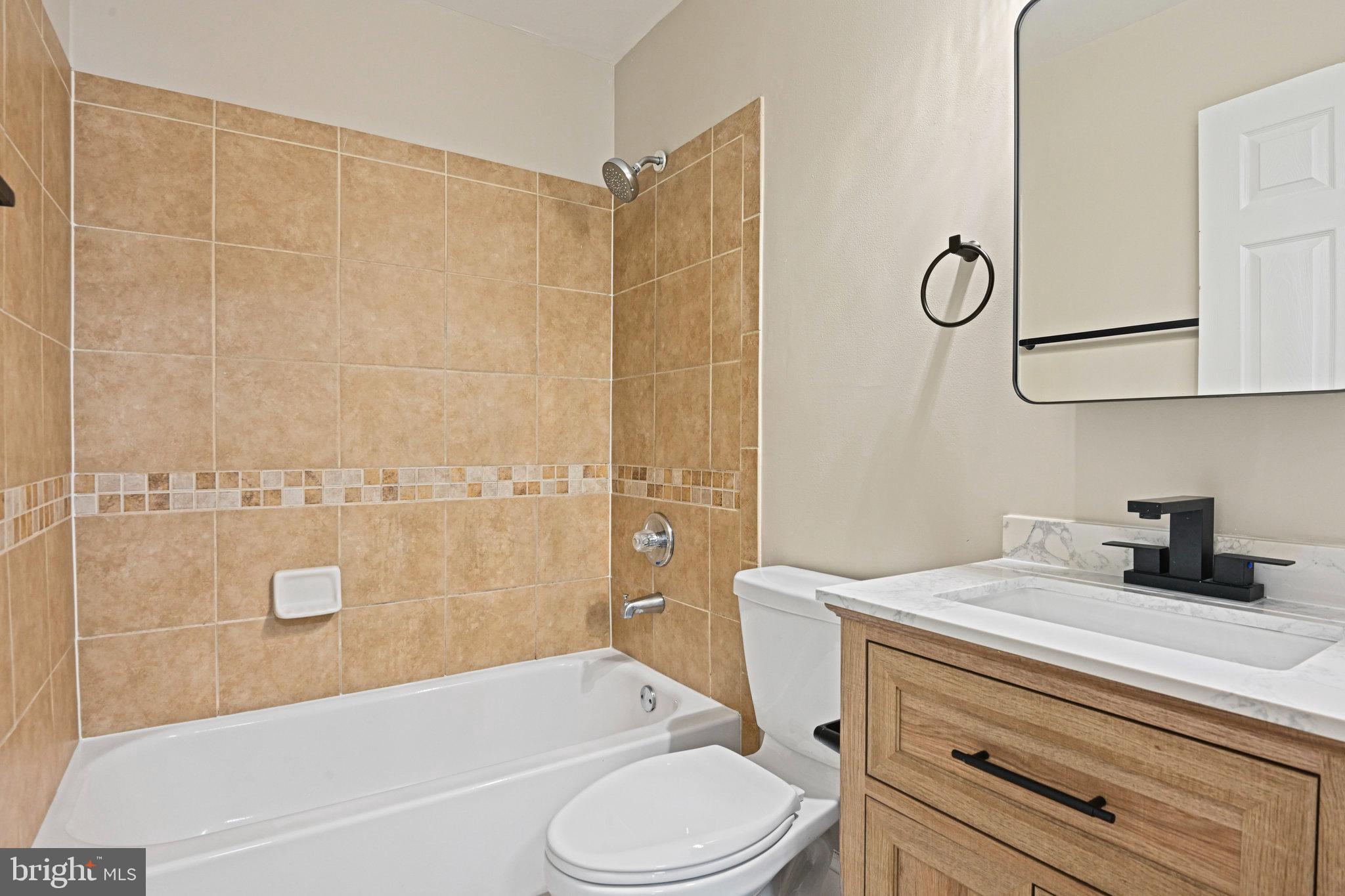 1002 South Buckingham Road Sterling, VA 20164 - Photo 15 of 18 a bathroom with a sink a toilet and shower