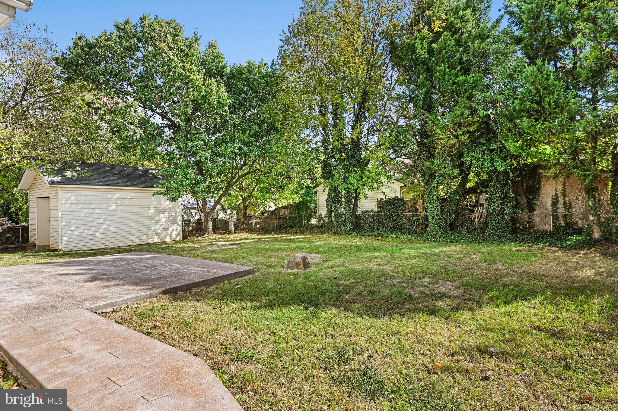 1002 South Buckingham Road Sterling, VA 20164 - Photo 16 of 18 a view of outdoor space with deck and yard