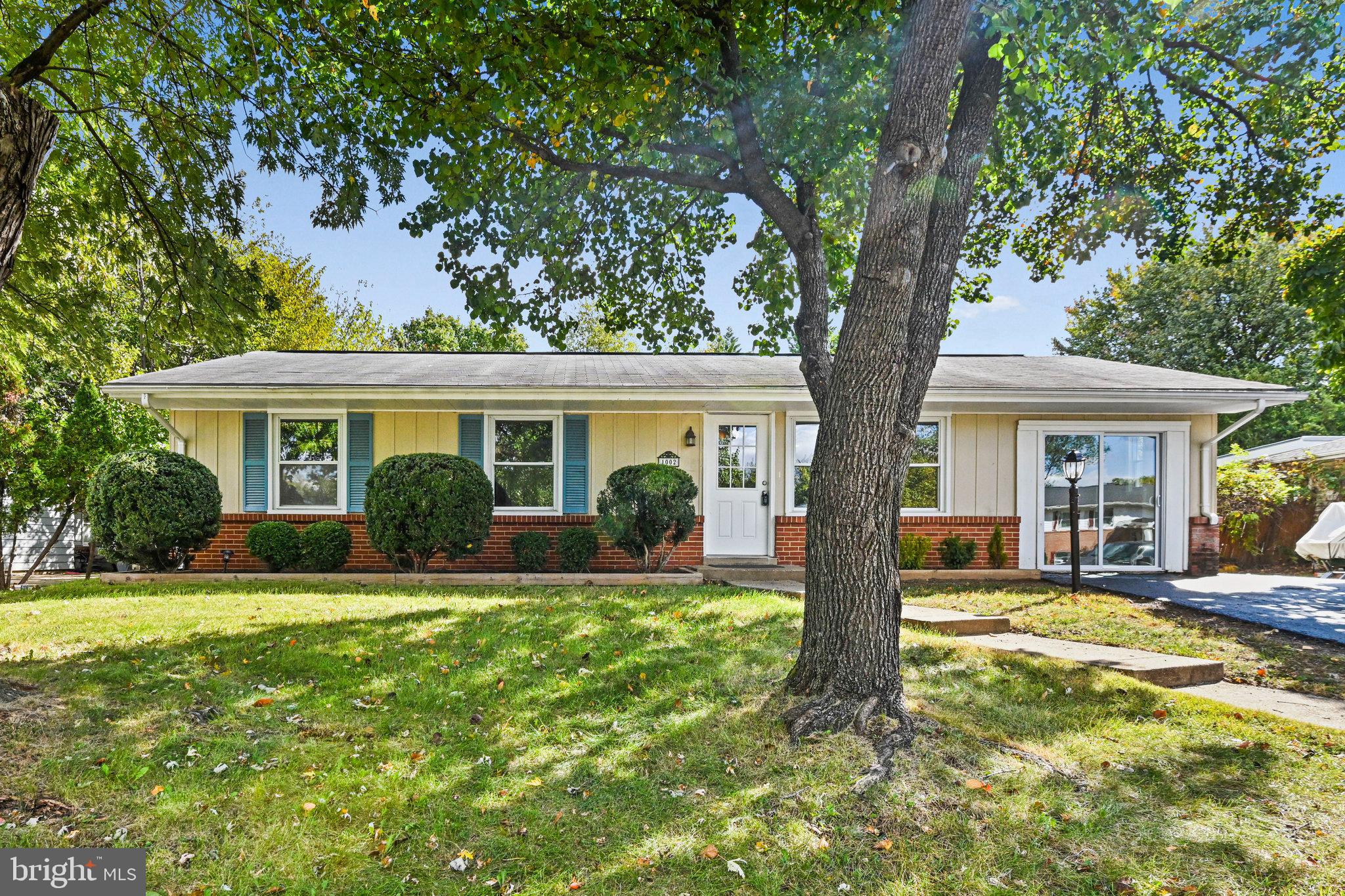 1002 South Buckingham Road Sterling, VA 20164 - Photo 18 of 18 a front view of house with a garden and patio
