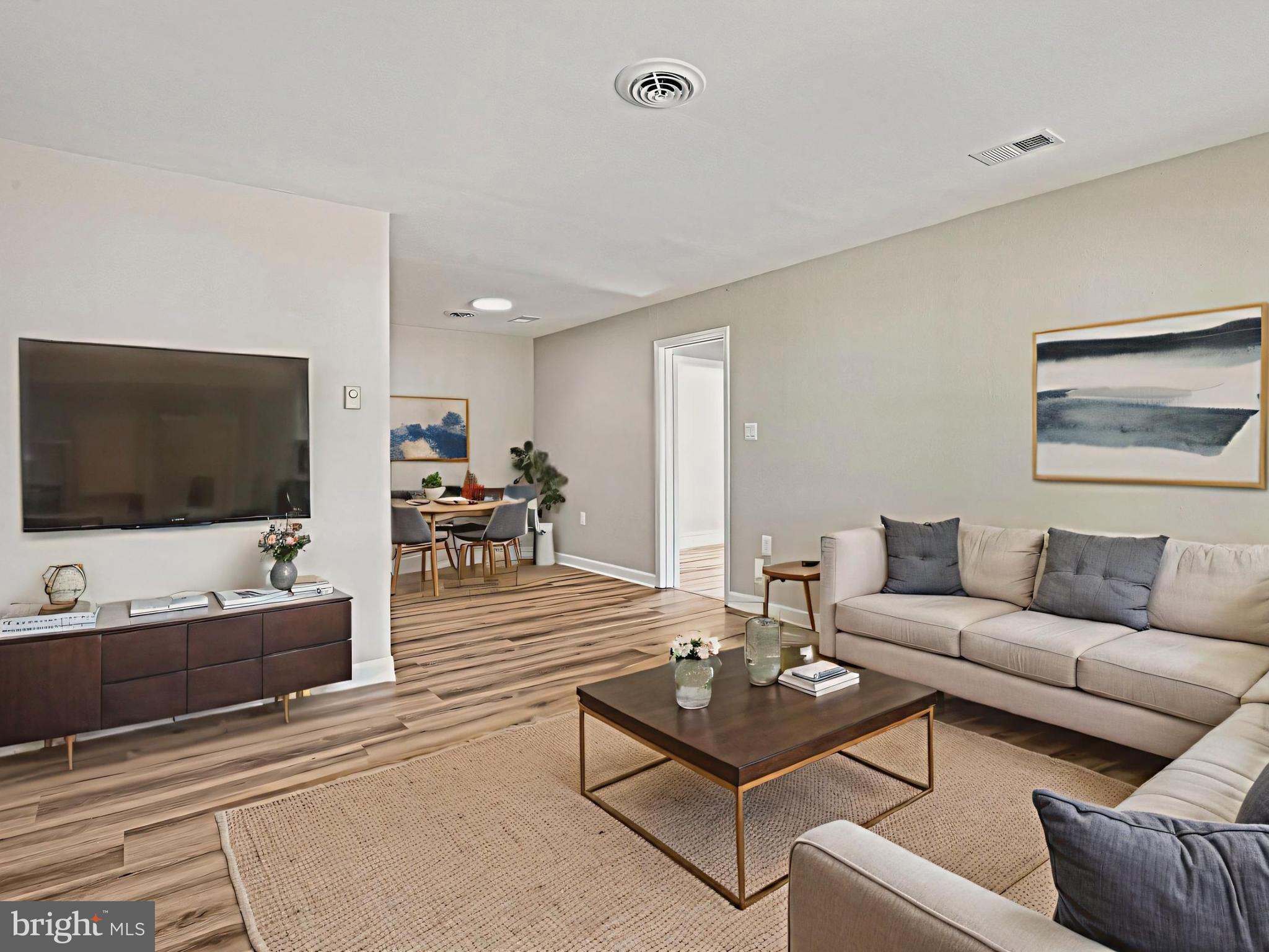 1002 South Buckingham Road Sterling, VA 20164 - Photo 2 of 18 a living room with furniture and a flat screen tv