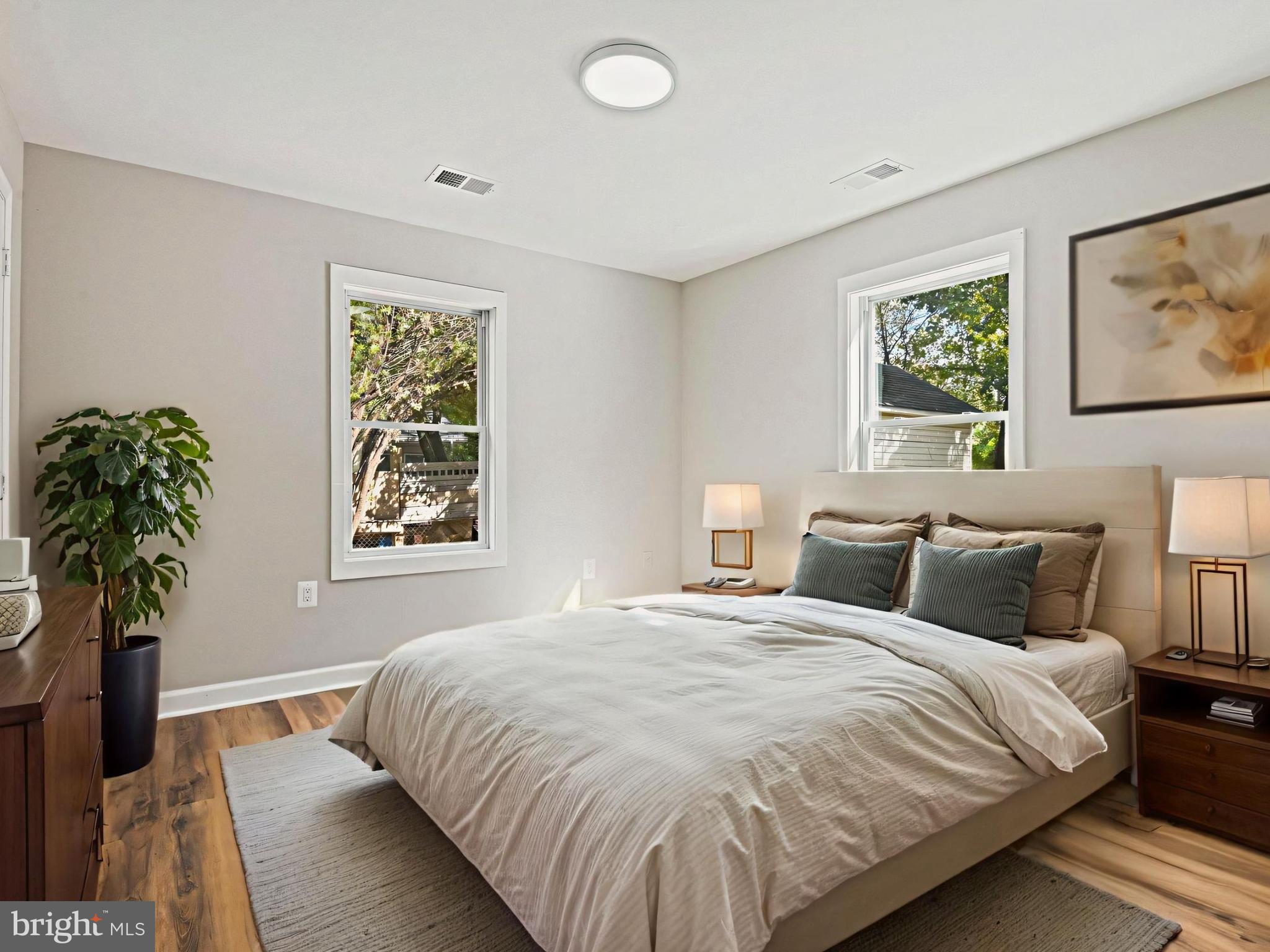 1002 South Buckingham Road Sterling, VA 20164 - Photo 4 of 18 a bedroom with bed and a potted plant