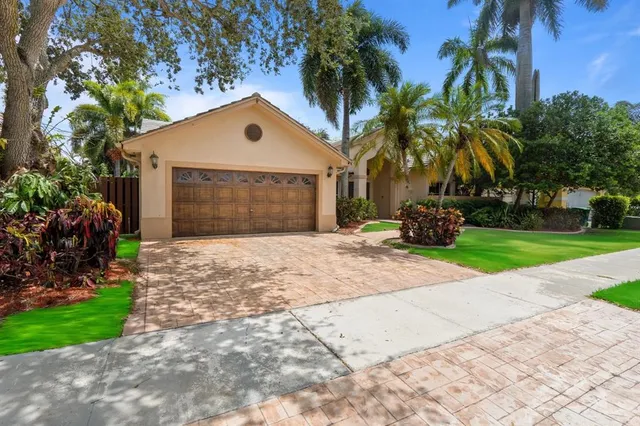 a front view of house with yard and green space